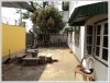 House in business area by the main road for sale