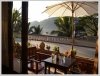 Traditional wooden houses hotel by the Mekong