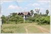 Land by Mekong with wall fence about 18km from city center