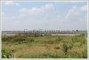 Land by Mekong with wall fence about 18km from city center