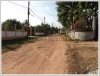 Vacant land by a road in fast developing area