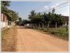 Vacant land by a road in fast developing area