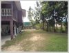 Land with an wooden house on quite large land for sale