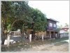 Lao traditional house by main road in Mekong Community