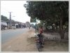 Lao traditional house by main road in Mekong Community