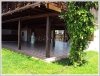 Wooden Lao style house by the Mekong