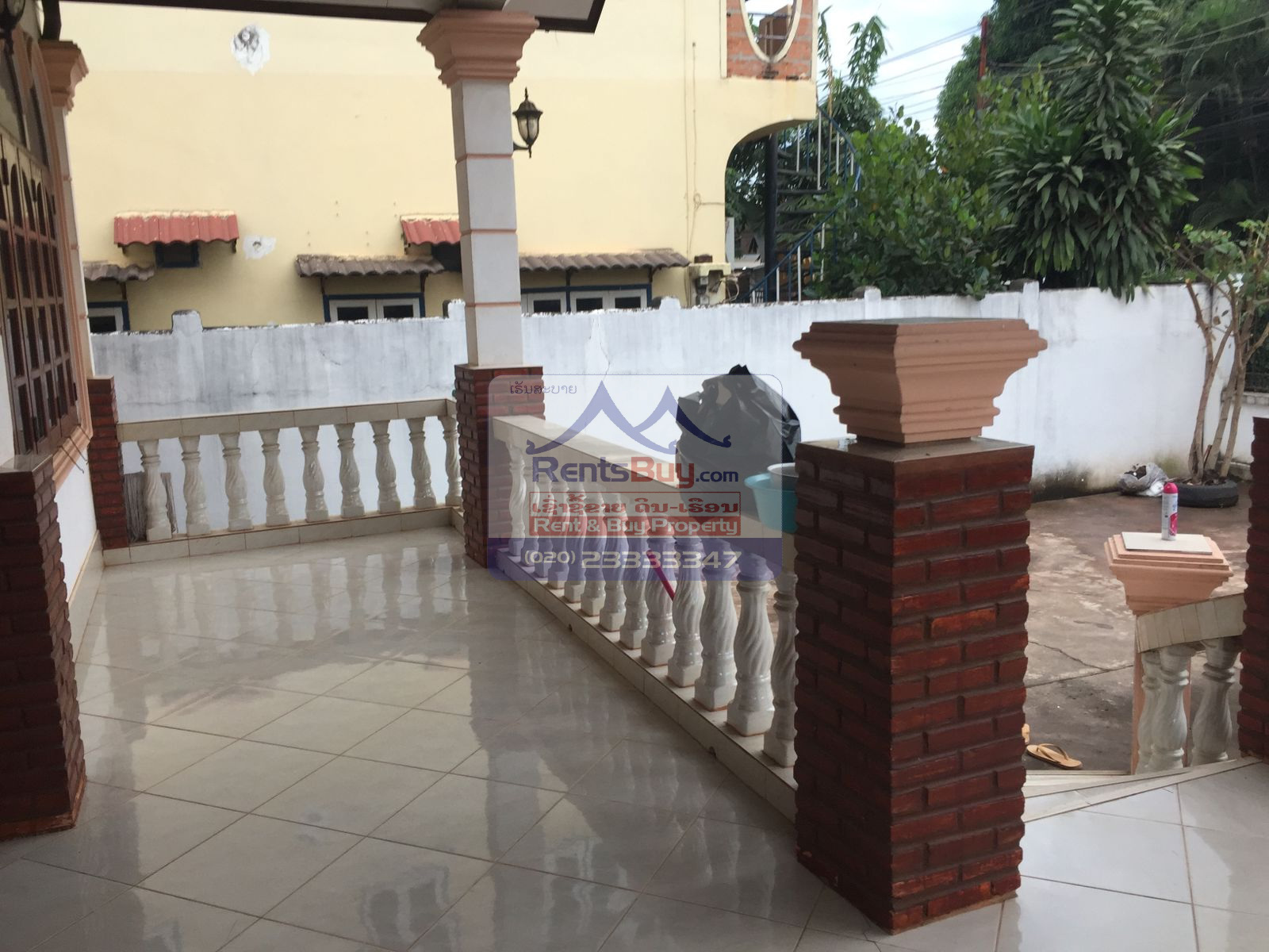6024 – The Charming 2-Story House for Rent. Nestled Patouxay Monument, Thatluang Golden Stupa and ITECC Shopping Mall.