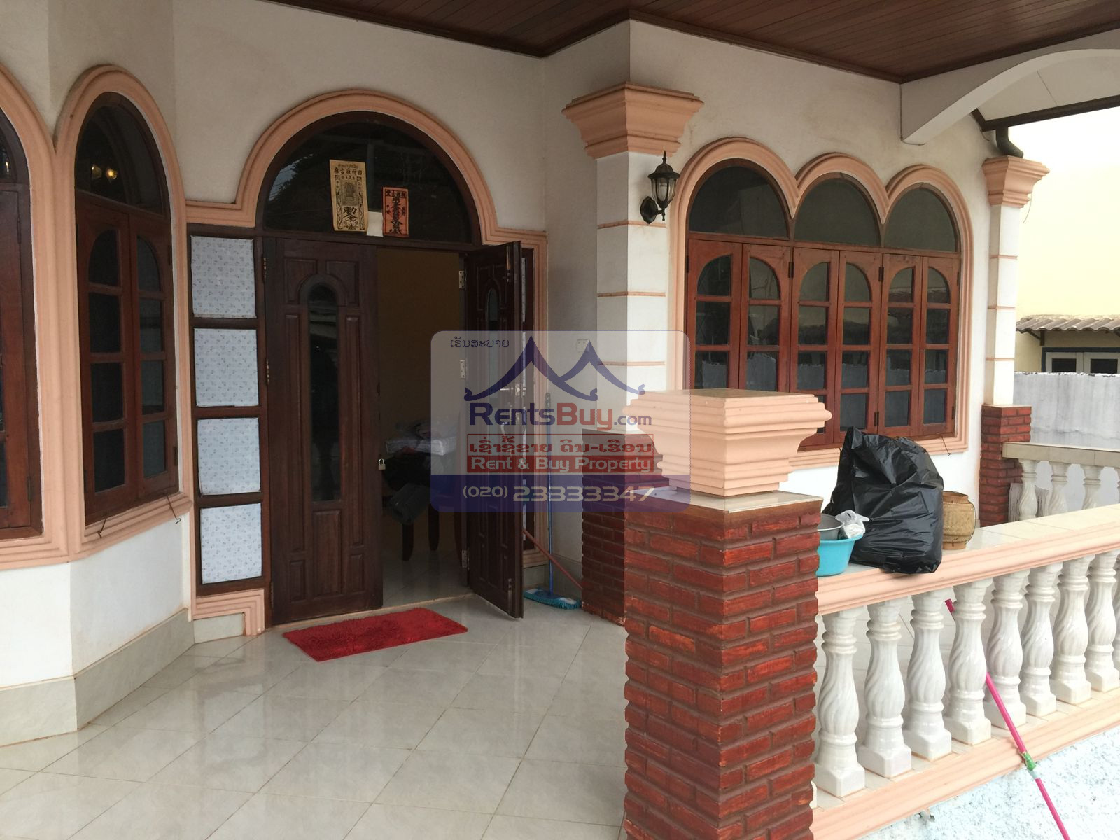 6024 – The Charming 2-Story House for Rent. Nestled Patouxay Monument, Thatluang Golden Stupa and ITECC Shopping Mall.