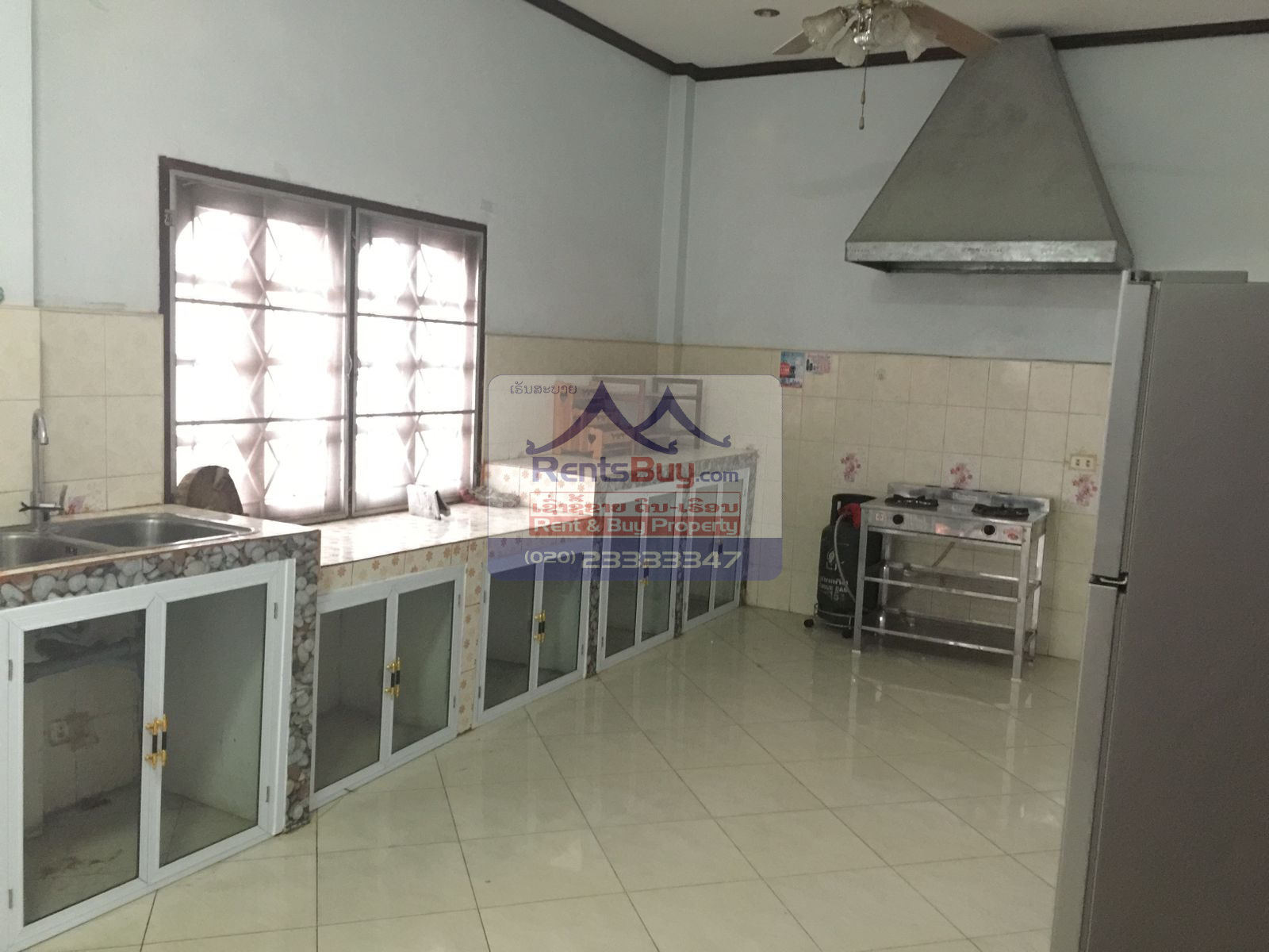 6024 – The Charming 2-Story House for Rent. Nestled Patouxay Monument, Thatluang Golden Stupa and ITECC Shopping Mall.